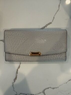 Burberry Light Gray Embossed Nova Leather Continental Wallet with Gold Hardware.